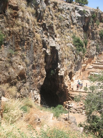 Photo from the left side of the cave showing the cave, the remains of the temples and the niches to the far right.